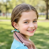 Young girl with a ponytail in a park